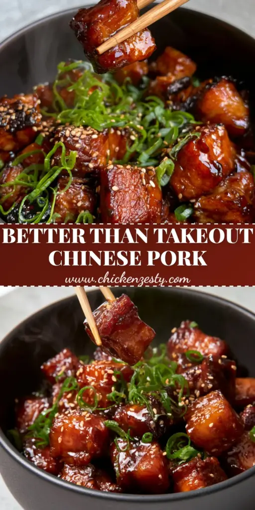 A close-up of Chinese style pork cubes in a mahogany glaze topped with scallion curls and sesame seeds.